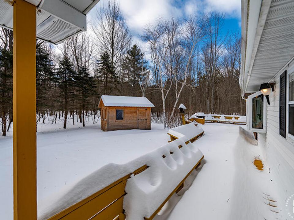 CapeCodStyleInKeeneValley_Deck_Shed